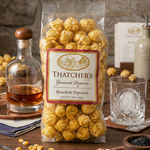 Thatcher's Bourbon Gourmet Popcorn - 7 oz. Bag. Artisanal caramel popcorn infused with rich bourbon flavor. A unique and sophisticated sweet treat from Thatcher's Gourmet Popcorn.