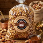 Bag of Thatchers Gourmet Popcorn with nuts and caramel on a wooden surface