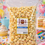Bag of Thatcher's Birthday Cake popcorn with a colorful birthday-themed background