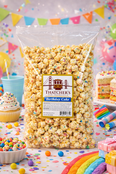 Bag of Thatcher's Birthday Cake popcorn with a colorful birthday-themed background