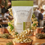 Hatcher's Parmesan & Italian Herbs popcorn in a decorative wreath on a wooden table.