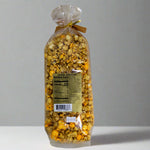 Bag of popcorn with a label on a gray background