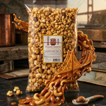 Bag of Thatcher's caramel and nut mix with a decorative bridge design on a dark surface.
