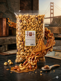 Bag of Thatcher's caramel and nut mix with a decorative bridge design on a dark surface.