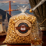 Bag of Hatcher's popcorn with a scenic view of the Golden Gate Bridge in the background