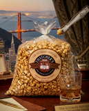 Bag of Hatcher's popcorn with a scenic view of the Golden Gate Bridge in the background
