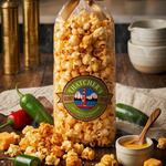 Bag of Fletcher's popcorn with jalapeños and cheese on a wooden table