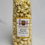 Bag of Thatcher's Za'atar Popcorn with a gold ribbon on a white background